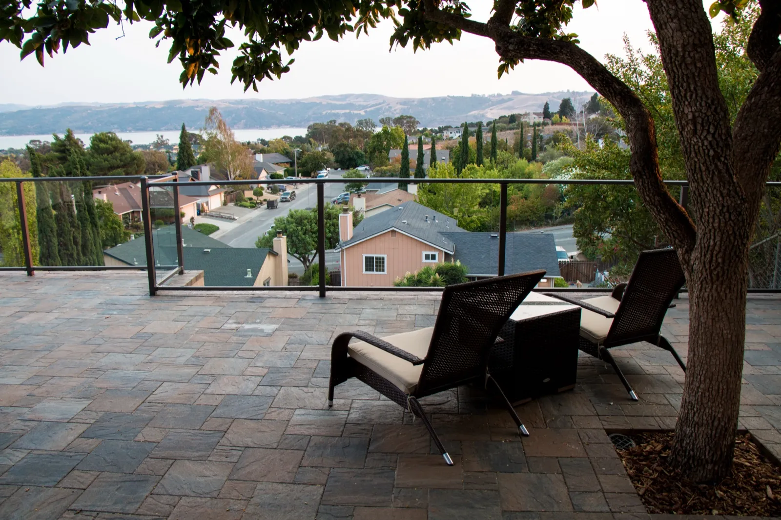 After — Rough hillside pad → shaded terrace lounge above the strait in Benicia