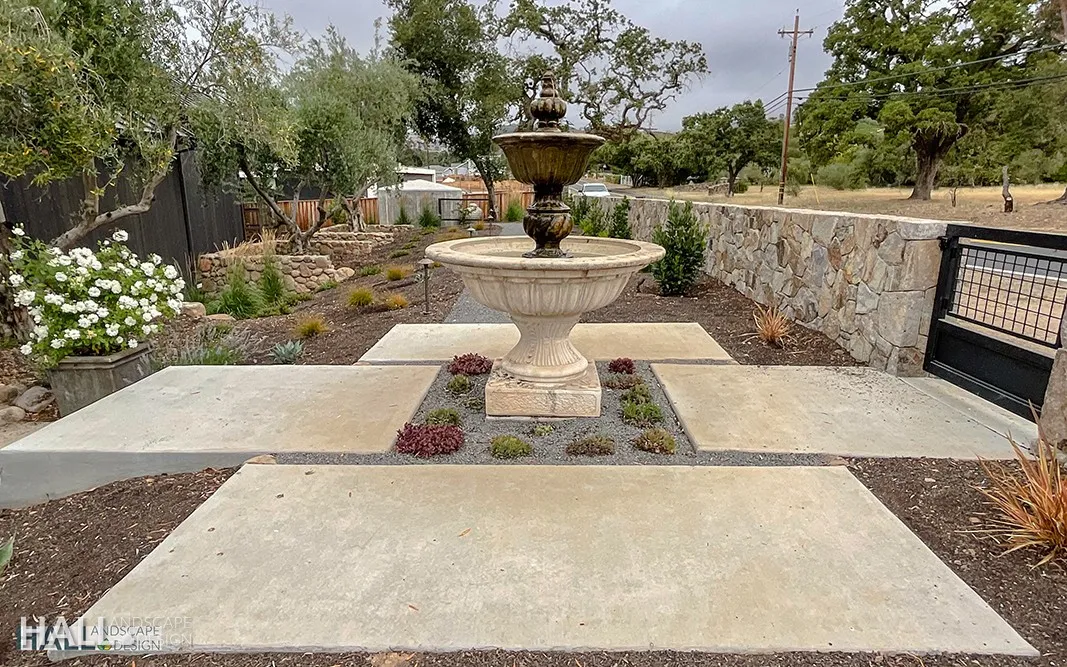 After — Bare concrete pads → tiered fountain courtyard in Calistoga