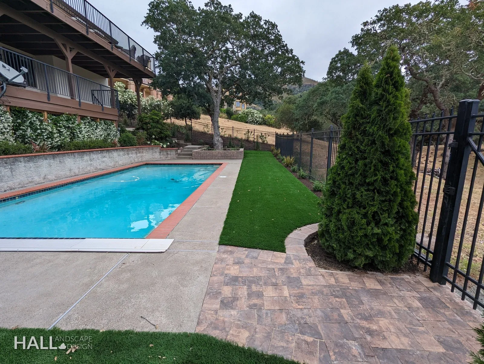 After — Dirt & rubble → pool deck, turf & a paver landing in Fairfield