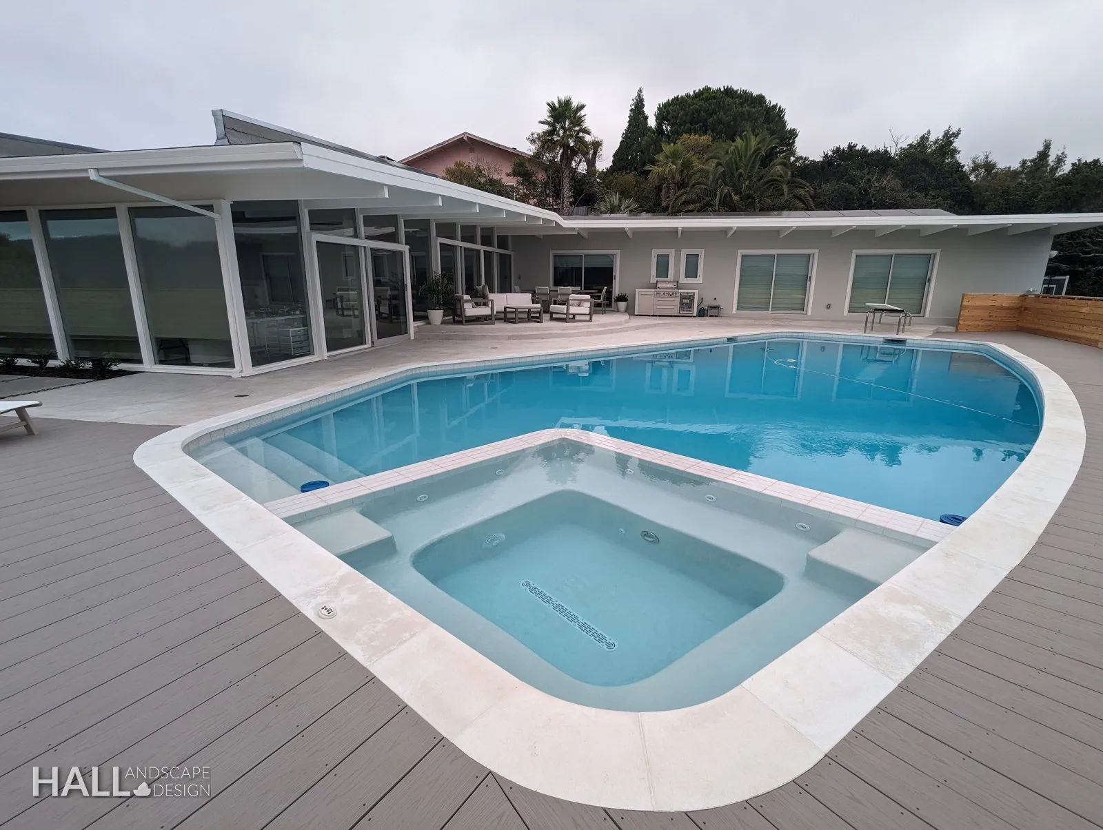 After — Worn pool deck → resurfaced pool with a new spa & pale coping in Greenbrae