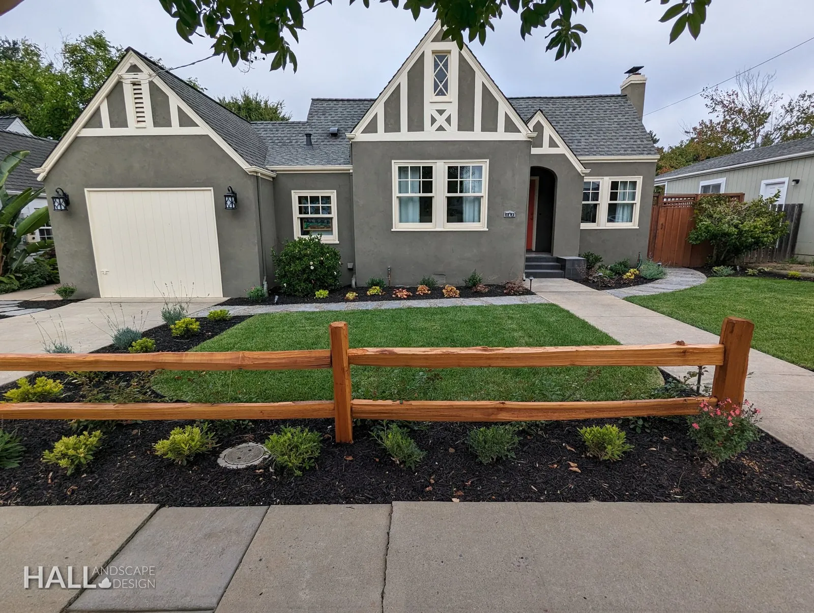 After — Plain front lawn → split-rail fence & layered planting beds in Healdsburg
