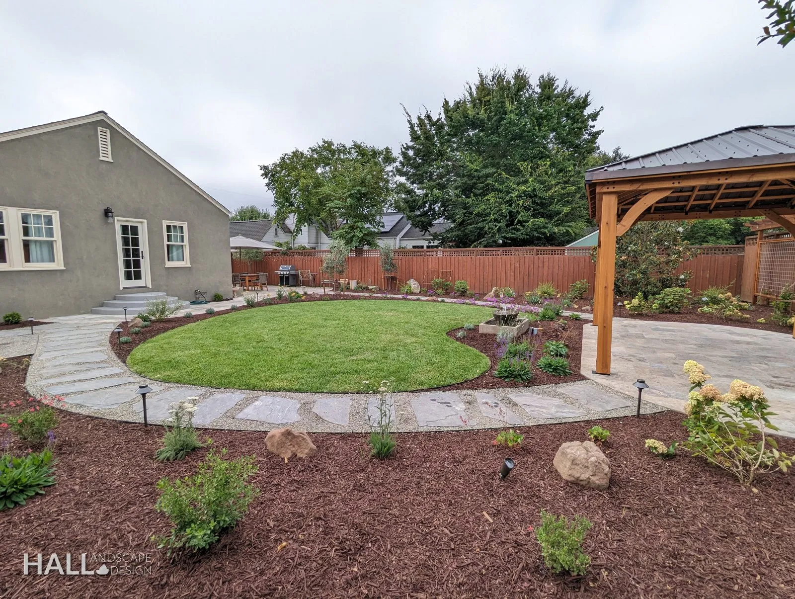 After — Bare dirt → pergola pavilion, circle lawn & landscape lighting in Healdsburg