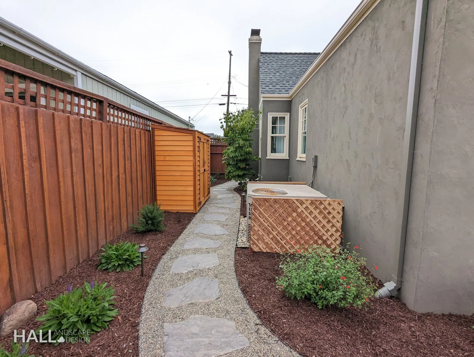 After — Gravel side yard → flagstone path, planting & a cedar screen in Healdsburg