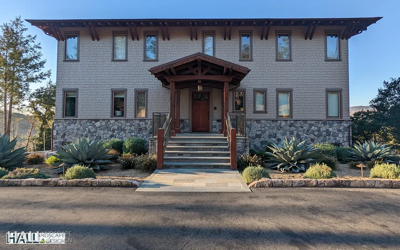After — Front entry reframed with stone walls, agave & native planting in Napa