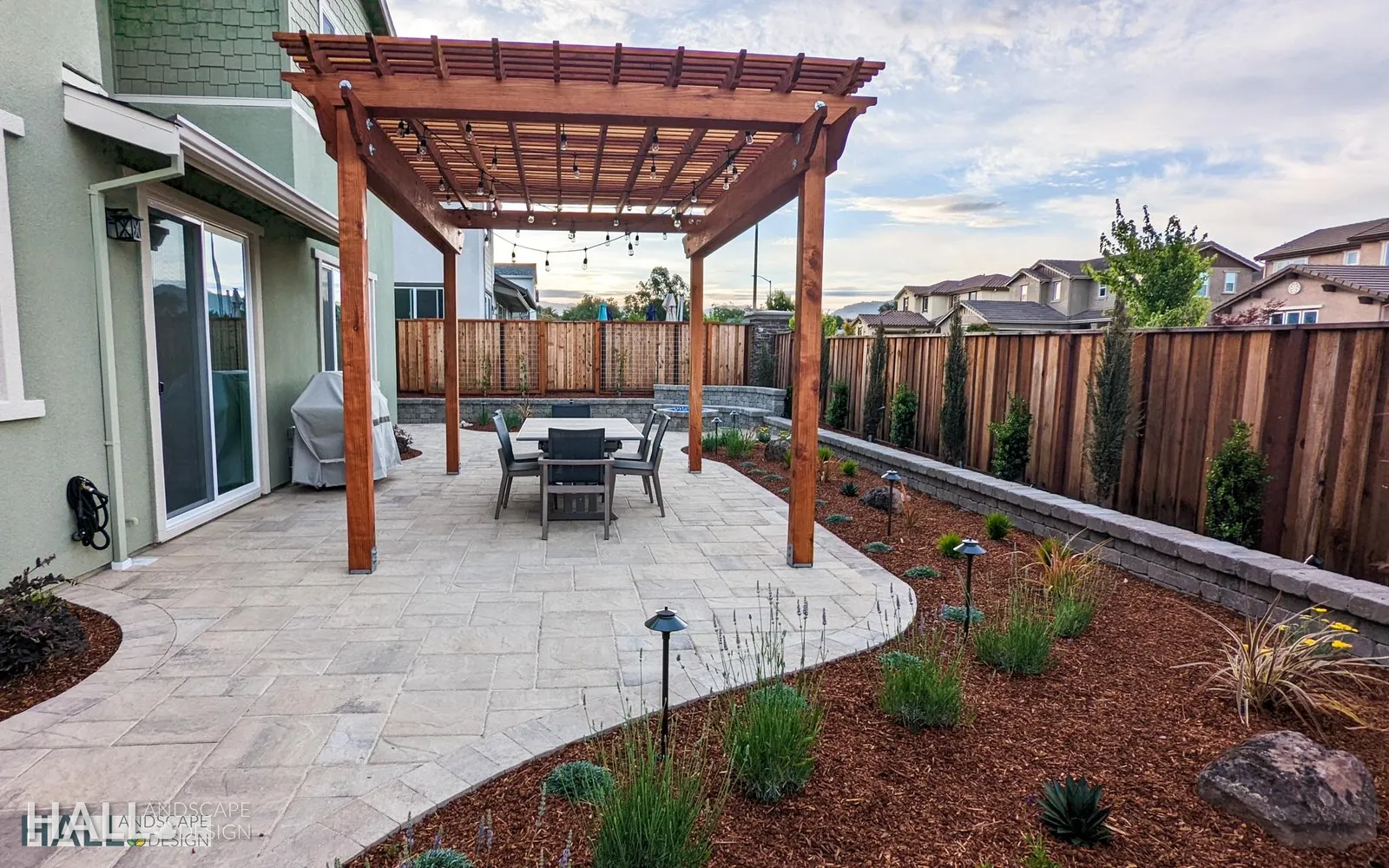 After — Bare new-build yard → paver fire-pit patio in Napa
