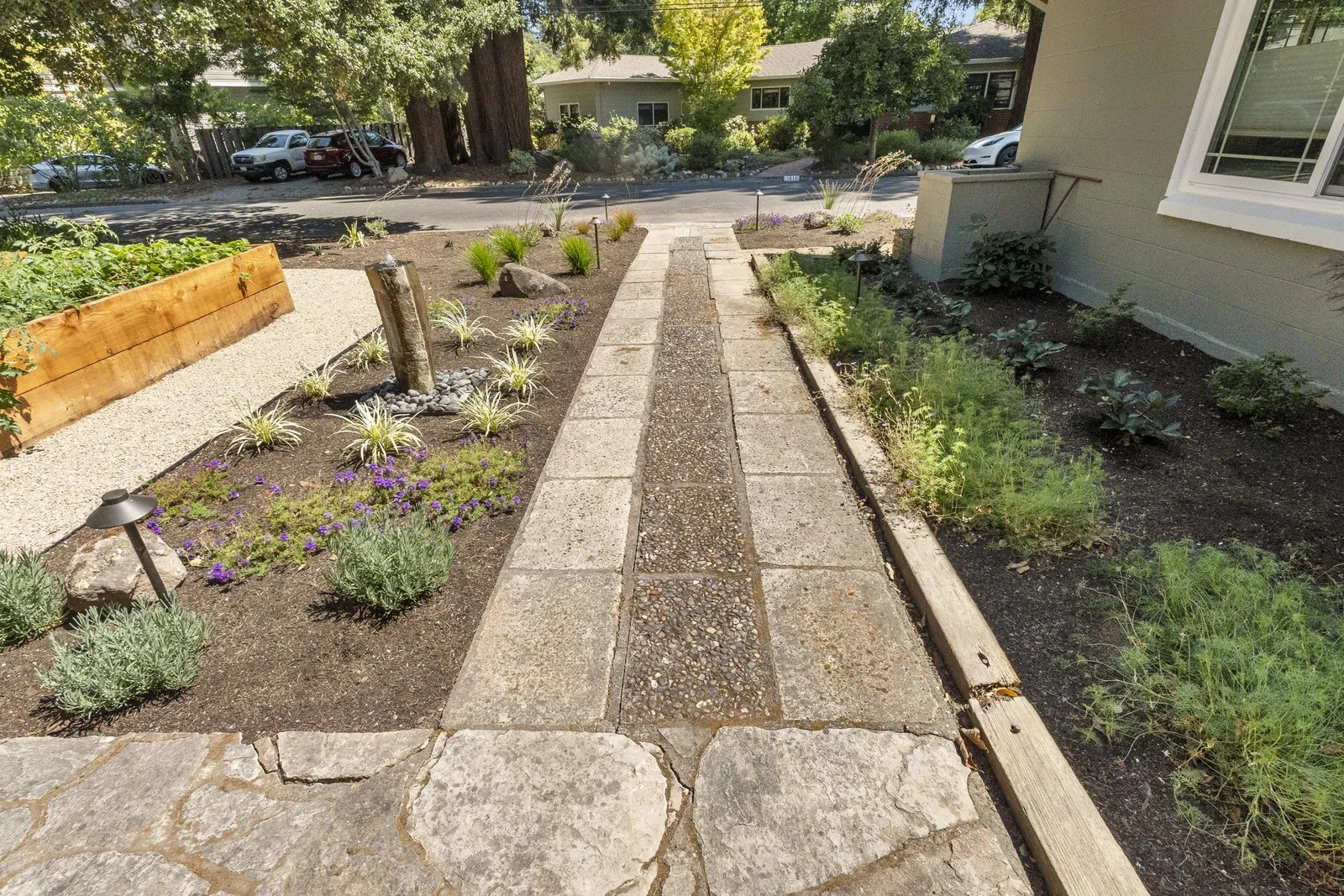 After — Front walk → raised beds, agaves & a focal-point fountain in Napa
