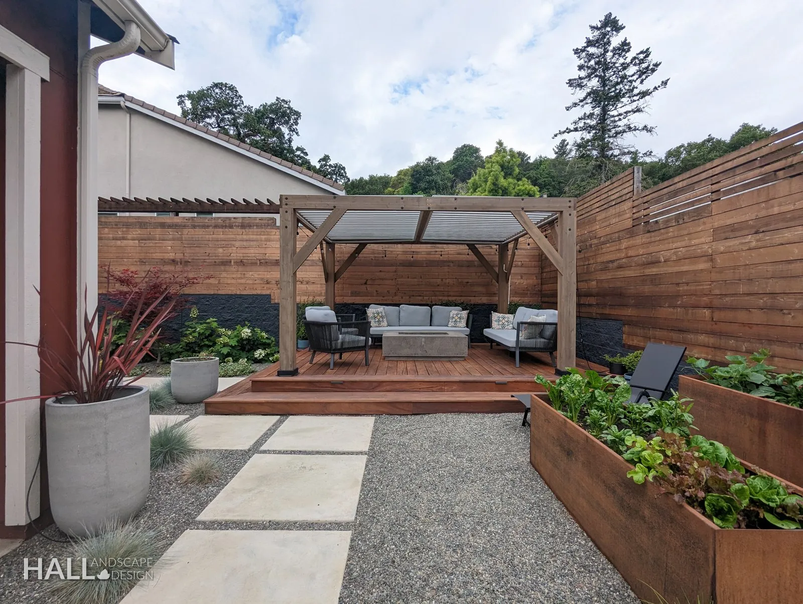 Courtyard lounge: Pergola, ipe deck, corten planters, gravel. A finished Hall Landscape Design garden in Napa, California.