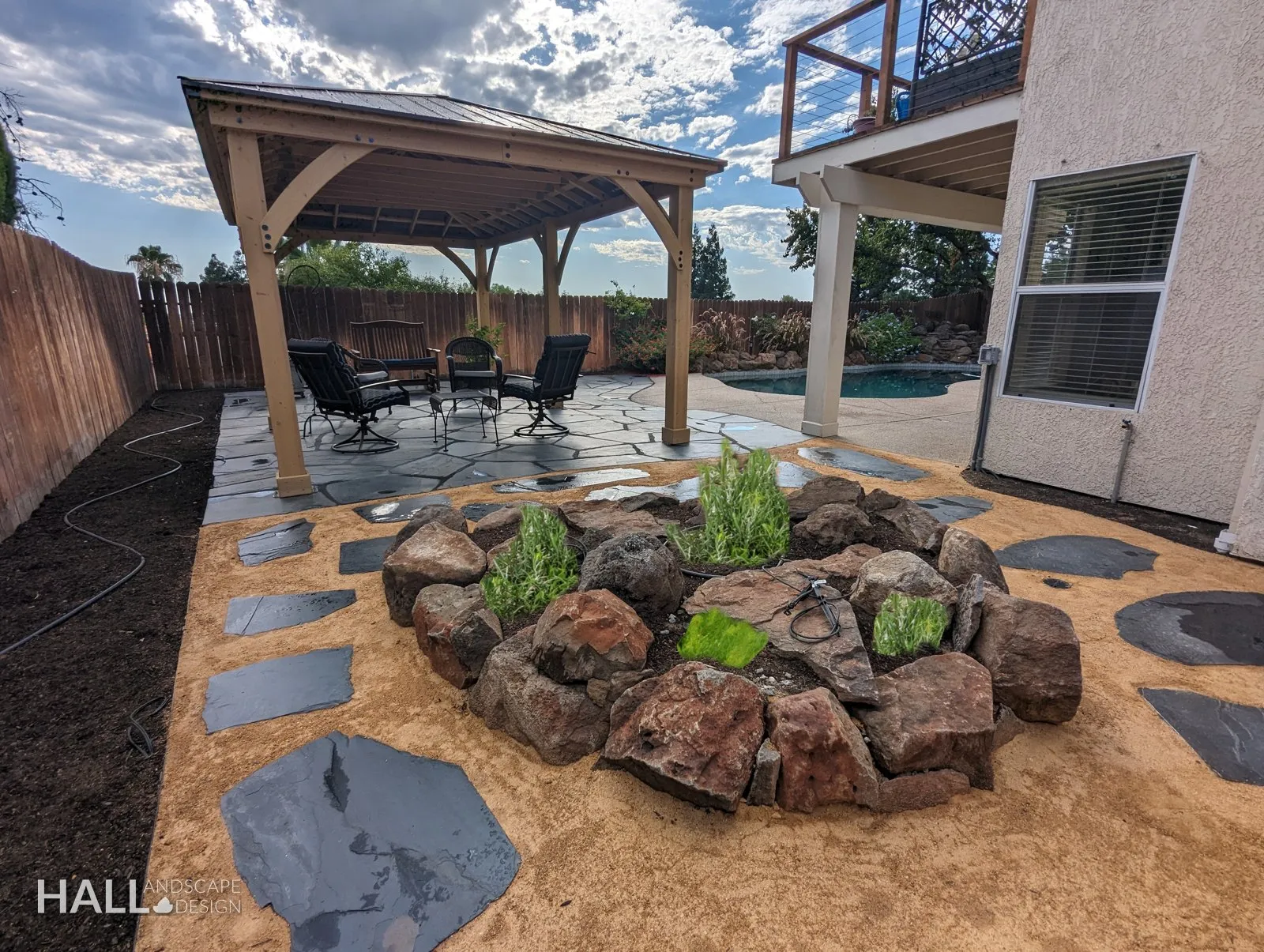 After — Lawn & basketball hoop → cedar pavilion, boulder herb garden & flagstone in Suisun City
