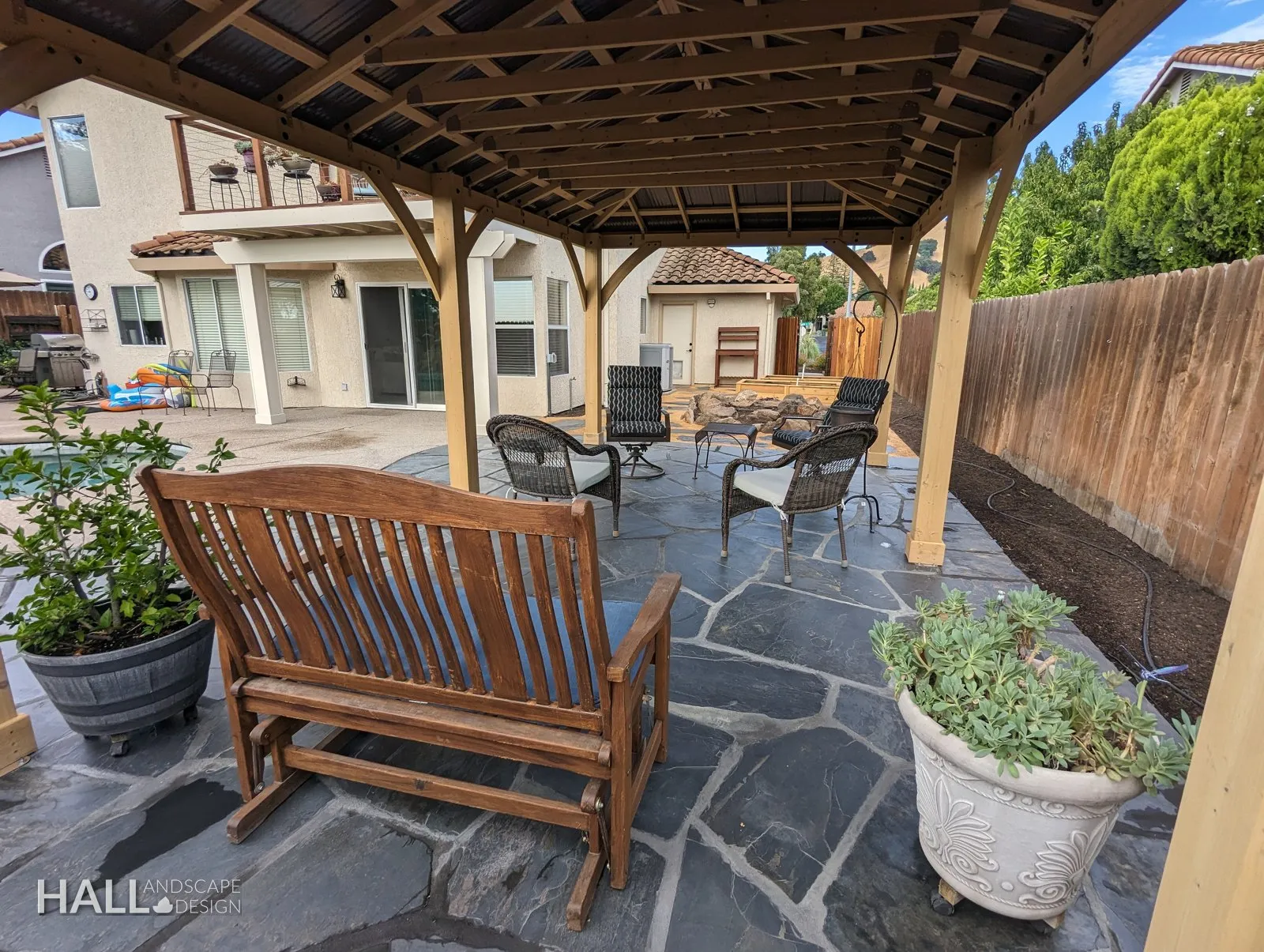 After — Deck dining set → shaded pavilion lounge on flagstone in Suisun City