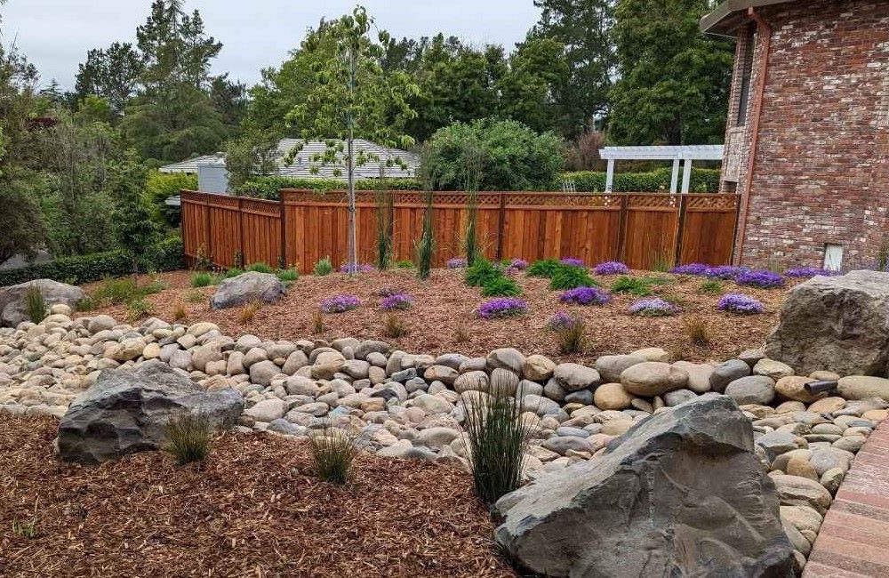 xeriscape landscaping with large rock dry stream bed