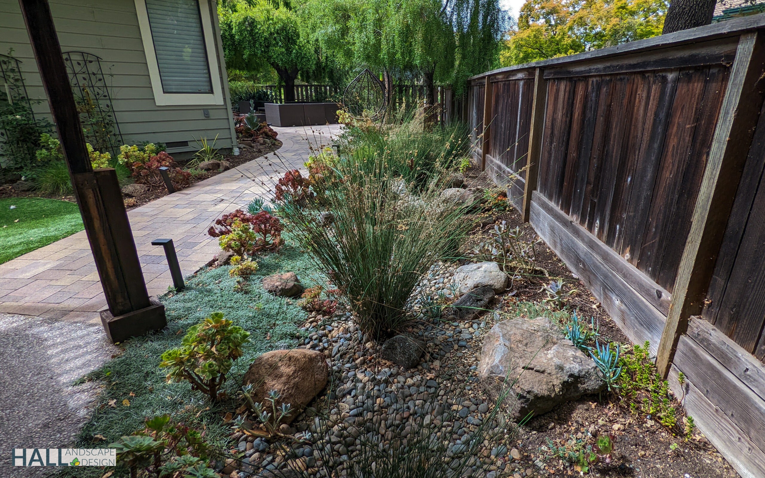 Sonoma Fire resistant landsaping Fire-resistant garden in Sonoma with gravel firebreaks and low shrubs.