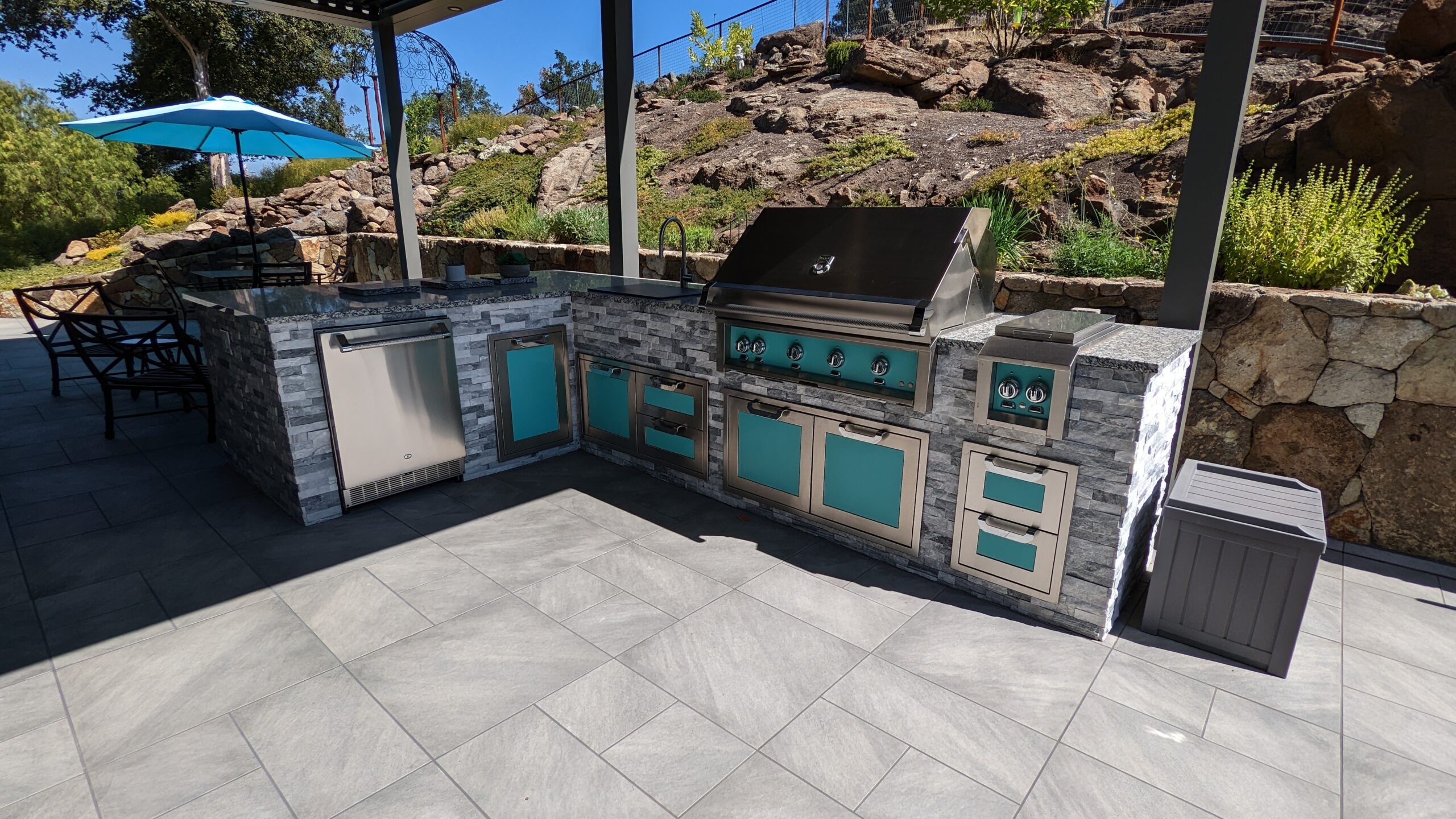 Napa outdoor kitchen Fire-safe landscape with bluestone terrace and water feature in Napa.